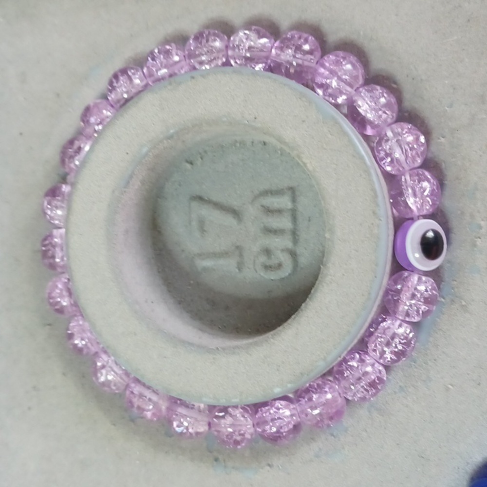 Purple cracked glass evil eye bead bracelet
